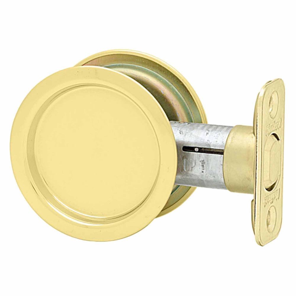 Kwikset Door Hardware Pocket Door Locks Round Passage Pocket Door Lock in Bright Brass
