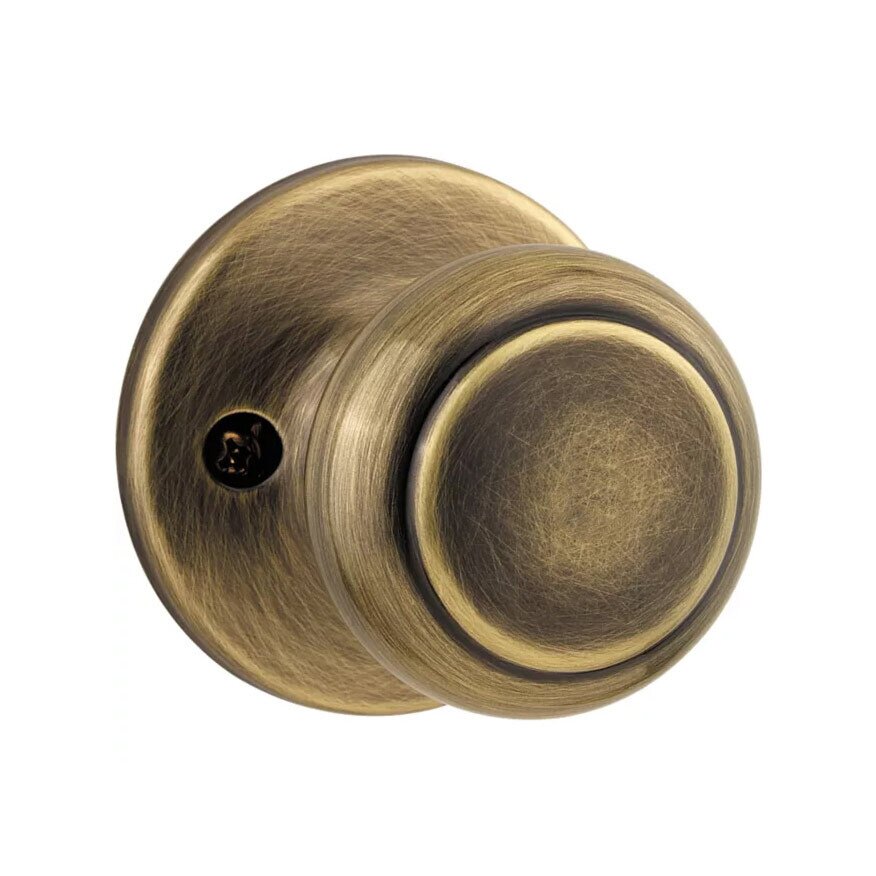Kwikset Door Hardware Cove Single Dummy Door Knob in Antique Brass
