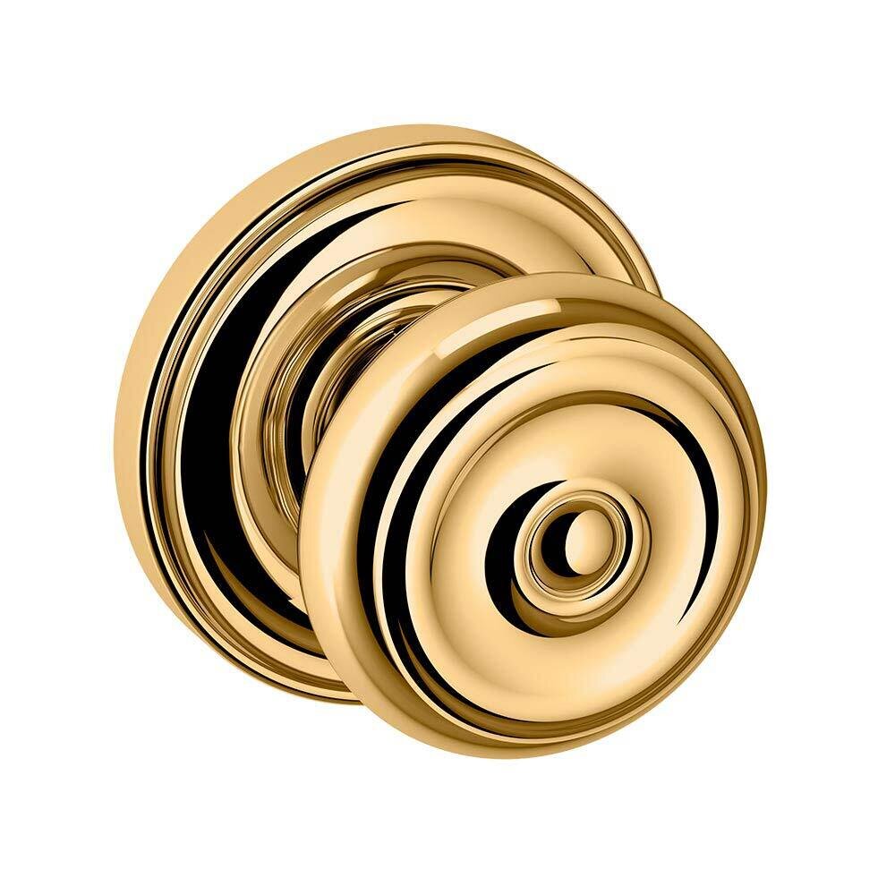 Baldwin Passage Colonial Door Knob with Classic Rose in Unlacquered Brass