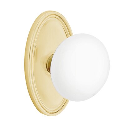 Emtek Passage Ice White Knob And Oval Rosette With Concealed Screws in Satin Brass