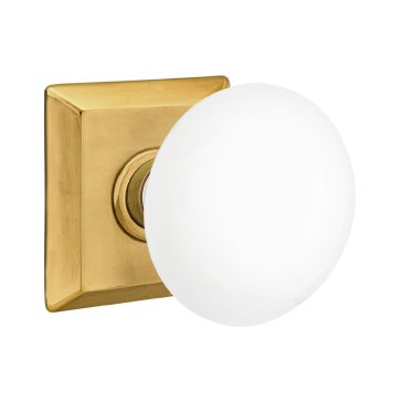 Emtek Passage Ice White Porcelain Knob With Quincy Rosette in French Antique Brass