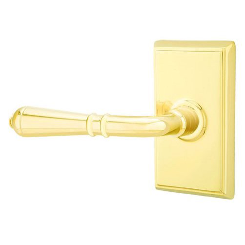 Emtek Double Dummy Left Handed Turino Door Lever With Rectangular Rose in Unlacquered Brass