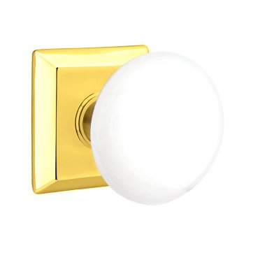Emtek Double Dummy Ice White Porcelain Knob With Quincy Rosette in Polished Brass
