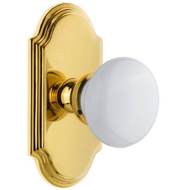 Grandeur Arc Plate Passage with Hyde Park White Porcelain Knob in Polished Brass
