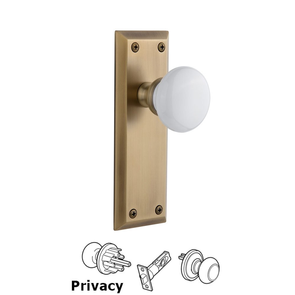 Grandeur Fifth Avenue Plate Privacy with Hyde Park White Porcelain Knob in Vintage Brass