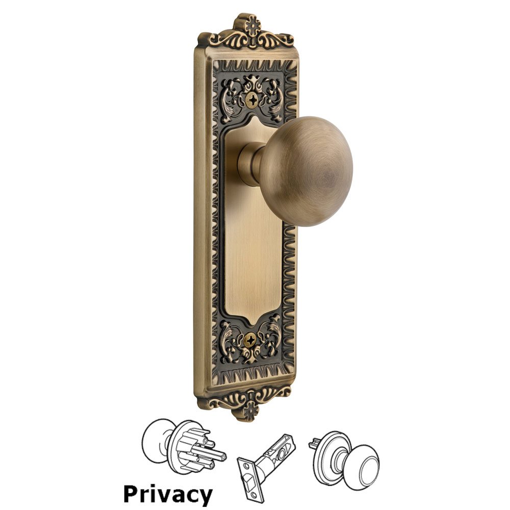 Grandeur Windsor Plate Privacy with Fifth Avenue knob in Vintage Brass