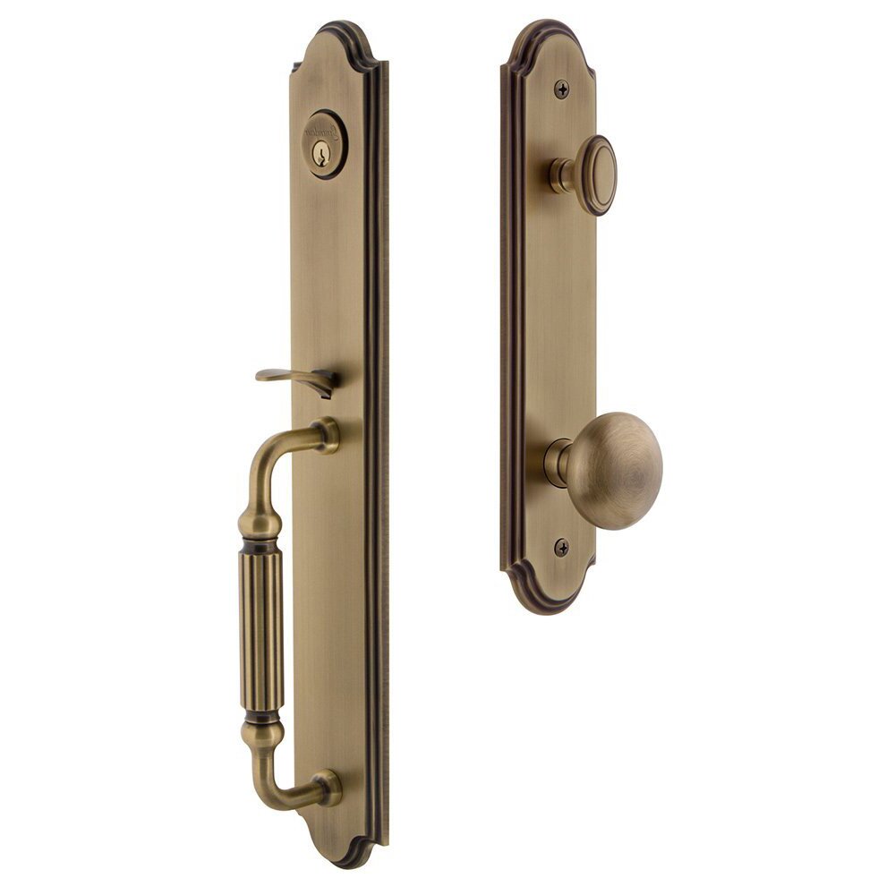 Grandeur Arc One-Piece Handleset with F Grip and Fifth Avenue Knob in Vintage Brass