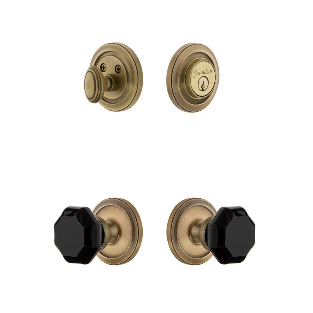 Grandeur Circulaire Rosette with Lyon Knob and matching Deadbolt in Vintage Brass