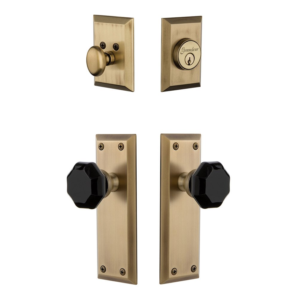 Grandeur Fifth Avenue Plate with Lyon Knob and matching Deadbolt in Vintage Brass