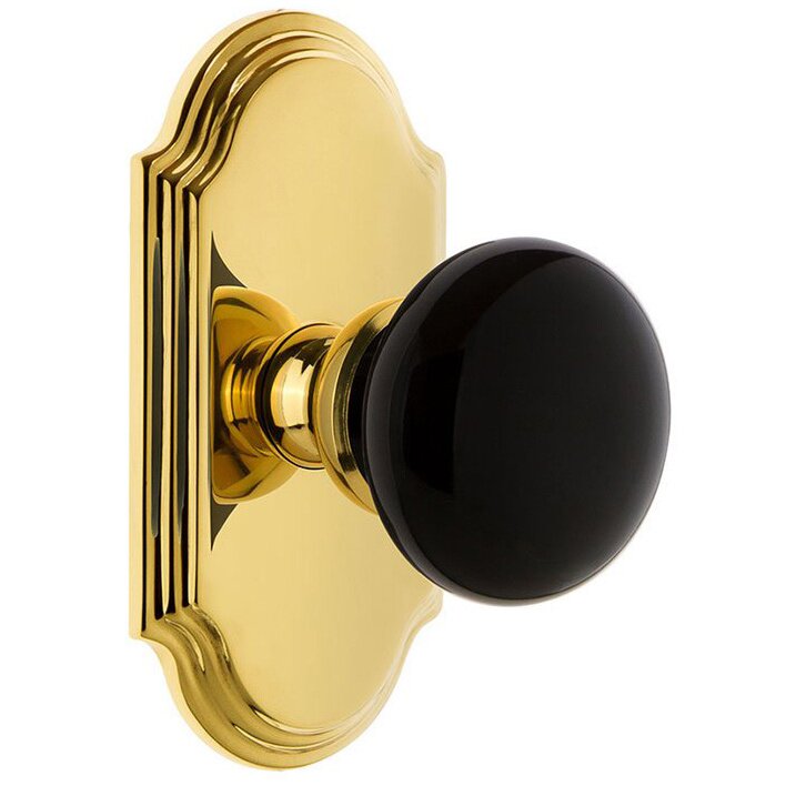 Grandeur Passage - Arc Rosette with Black Coventry Porcelain Knob in Polished Brass