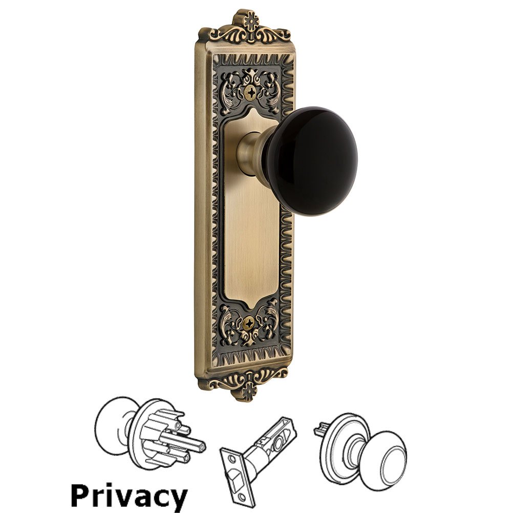 Grandeur Privacy - Windsor Rosette with Black Coventry Porcelain Knob in Vintage Brass