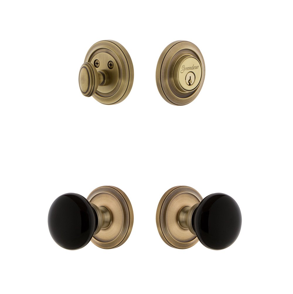 Grandeur Circulaire Rosette with Coventry Knob and matching Deadbolt in Vintage Brass