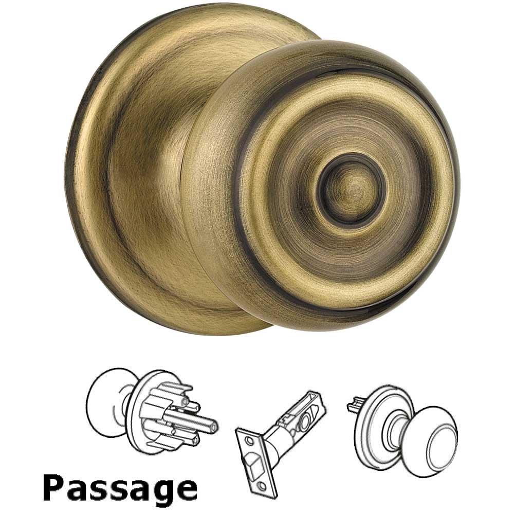 Kwikset Door Hardware Phoenix Passage Door Knob in Antique Brass
