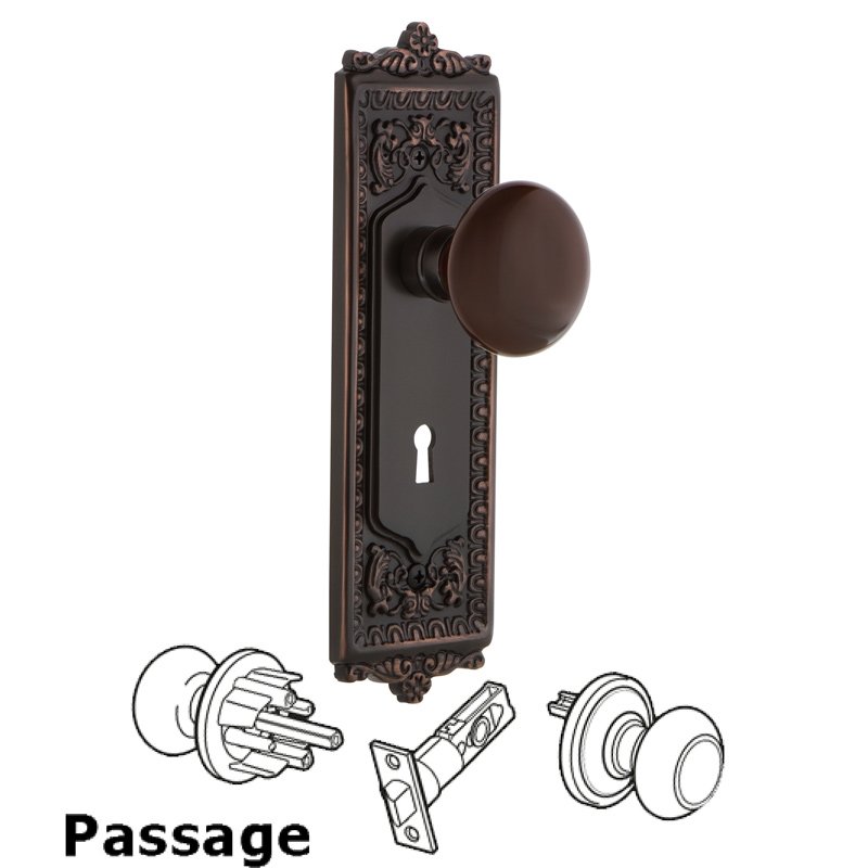 Nostalgic Warehouse Passage Egg & Dart Plate with Keyhole and Brown Porcelain Door Knob in Timeless Bronze