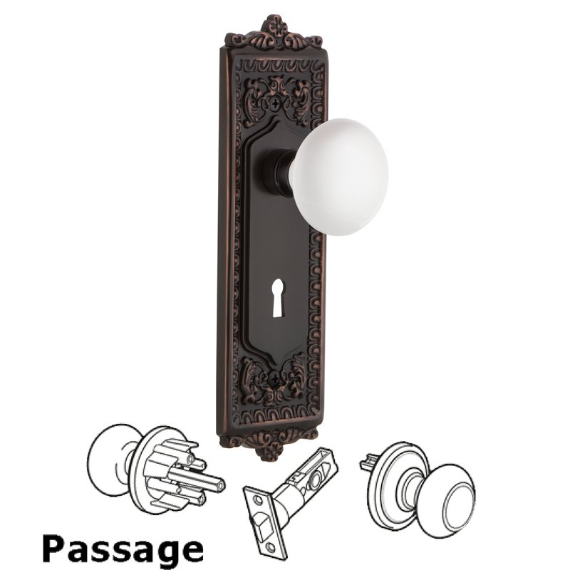 Nostalgic Warehouse Passage Egg & Dart Plate with Keyhole and White Porcelain Door Knob in Timeless Bronze
