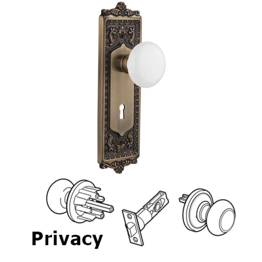 Nostalgic Warehouse Privacy Egg & Dart Plate with Keyhole and White Porcelain Door Knob in Antique Brass