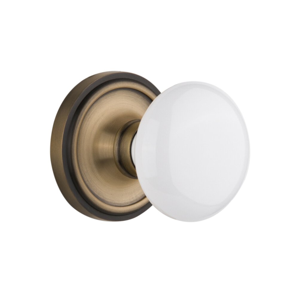 Nostalgic Warehouse Complete Privacy Set Without Keyhole - Classic Rosette with White Porcelain Knob in Antique Brass