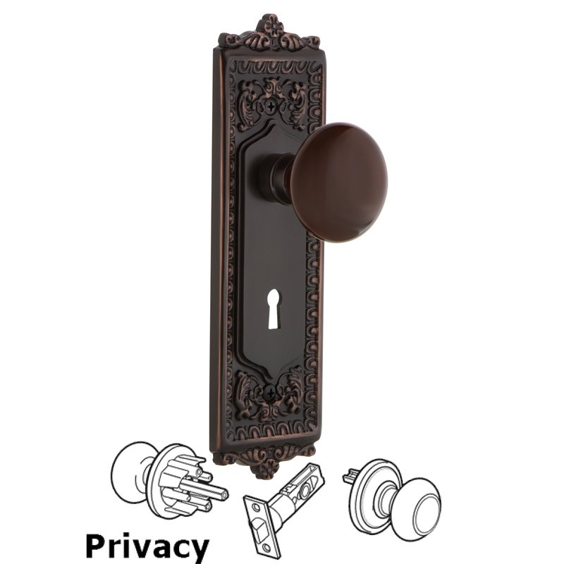 Nostalgic Warehouse Privacy Egg & Dart Plate with Keyhole and Brown Porcelain Door Knob in Timeless Bronze