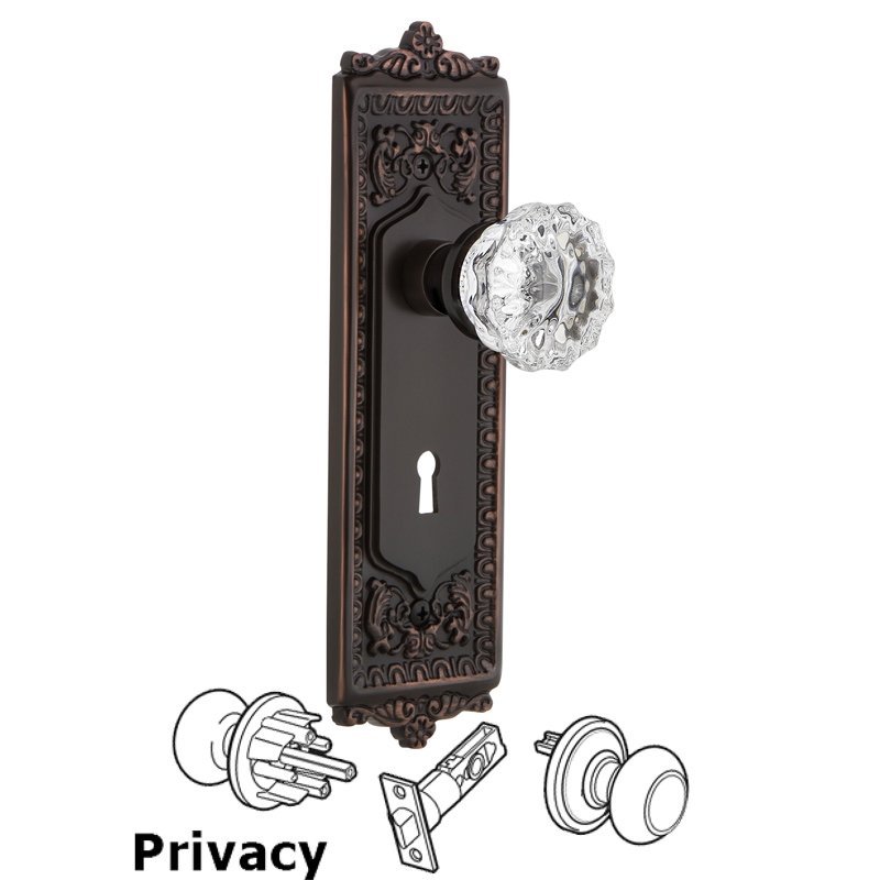 Nostalgic Warehouse Privacy Egg & Dart Plate with Keyhole and Crystal Glass Door Knob in Timeless Bronze