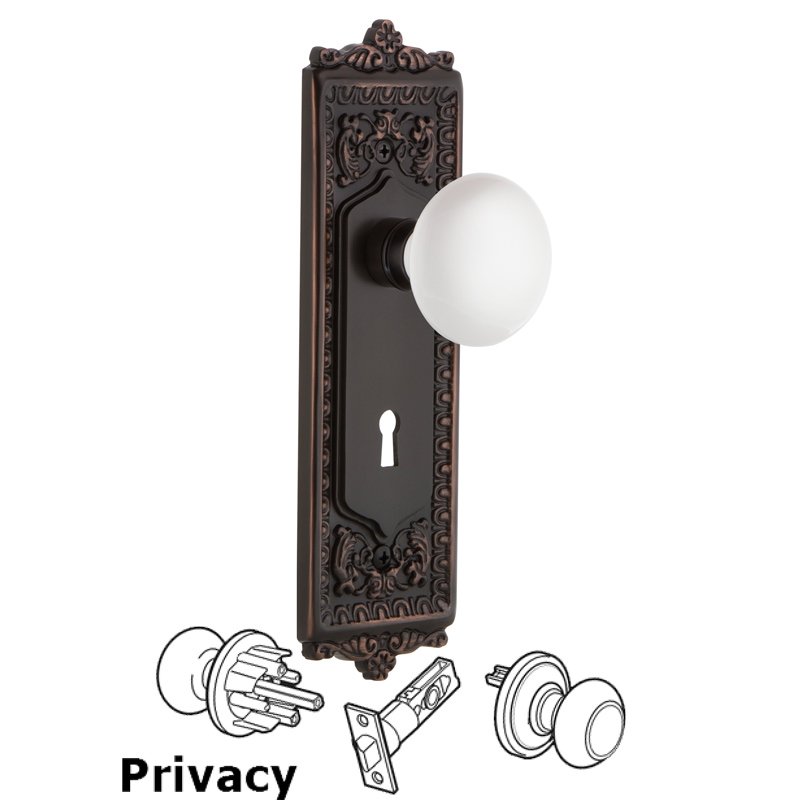 Nostalgic Warehouse Privacy Egg & Dart Plate with Keyhole and White Porcelain Door Knob in Timeless Bronze