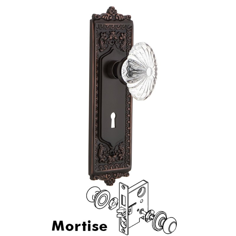 Nostalgic Warehouse Complete Mortise Lockset with Keyhole - Egg & Dart Plate with Oval Fluted Crystal Glass Door Knob in Timeless Bronze