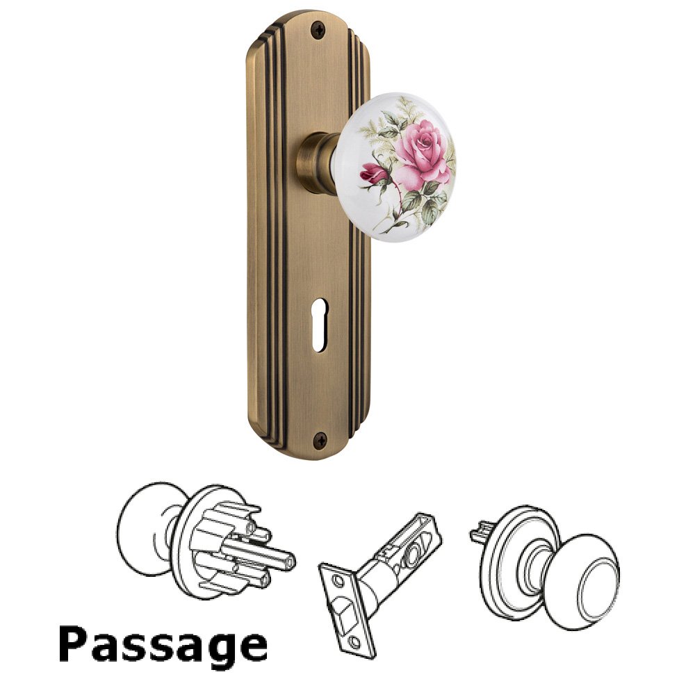 Nostalgic Warehouse Passage Deco Plate with Keyhole and White Rose Porcelain Door Knob in Antique Brass
