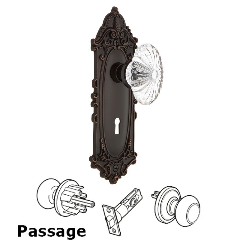 Nostalgic Warehouse Passage Victorian Plate with Keyhole and Oval Fluted Crystal Glass Door Knob in Timeless Bronze