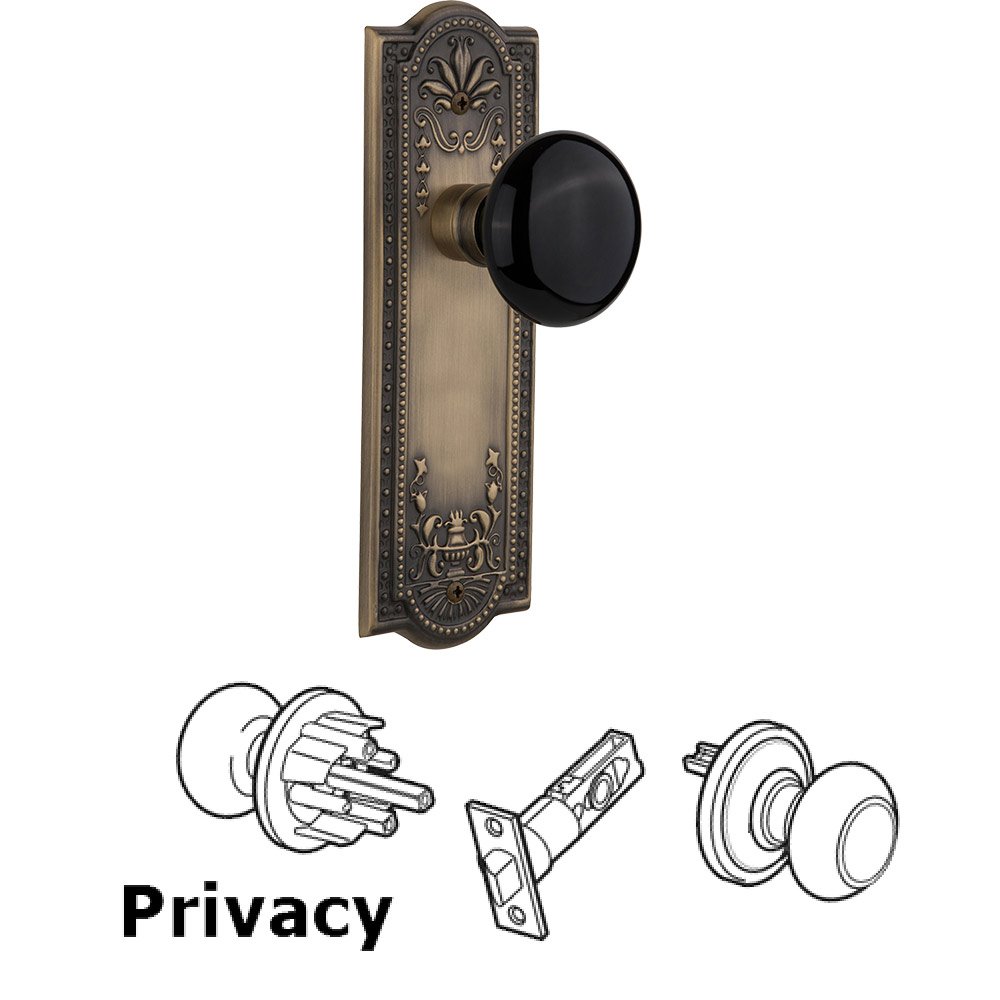 Nostalgic Warehouse Privacy Knob - Meadows Plate with Black Porcelain Knob without Keyhole in Antique Brass