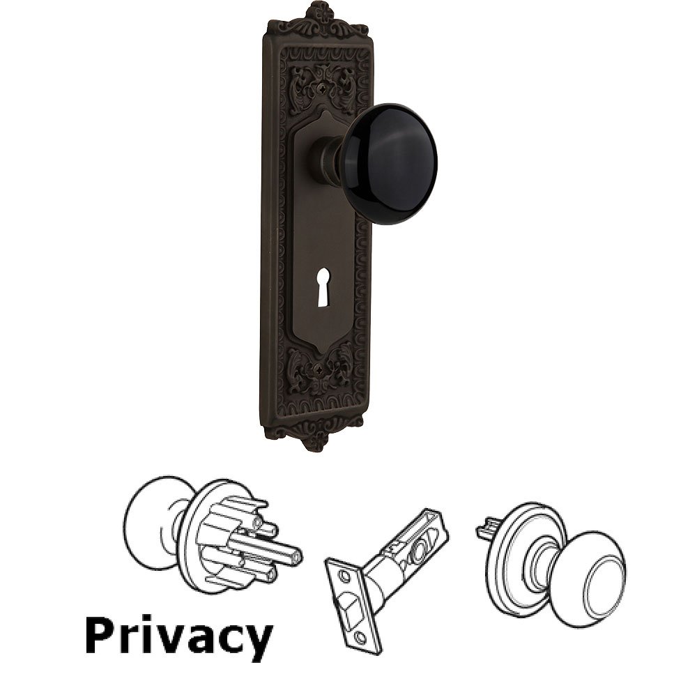 Nostalgic Warehouse Privacy Knob - Egg and Dart Plate with Black Porcelain Knob with Keyhole in Oil Rubbed Bronze
