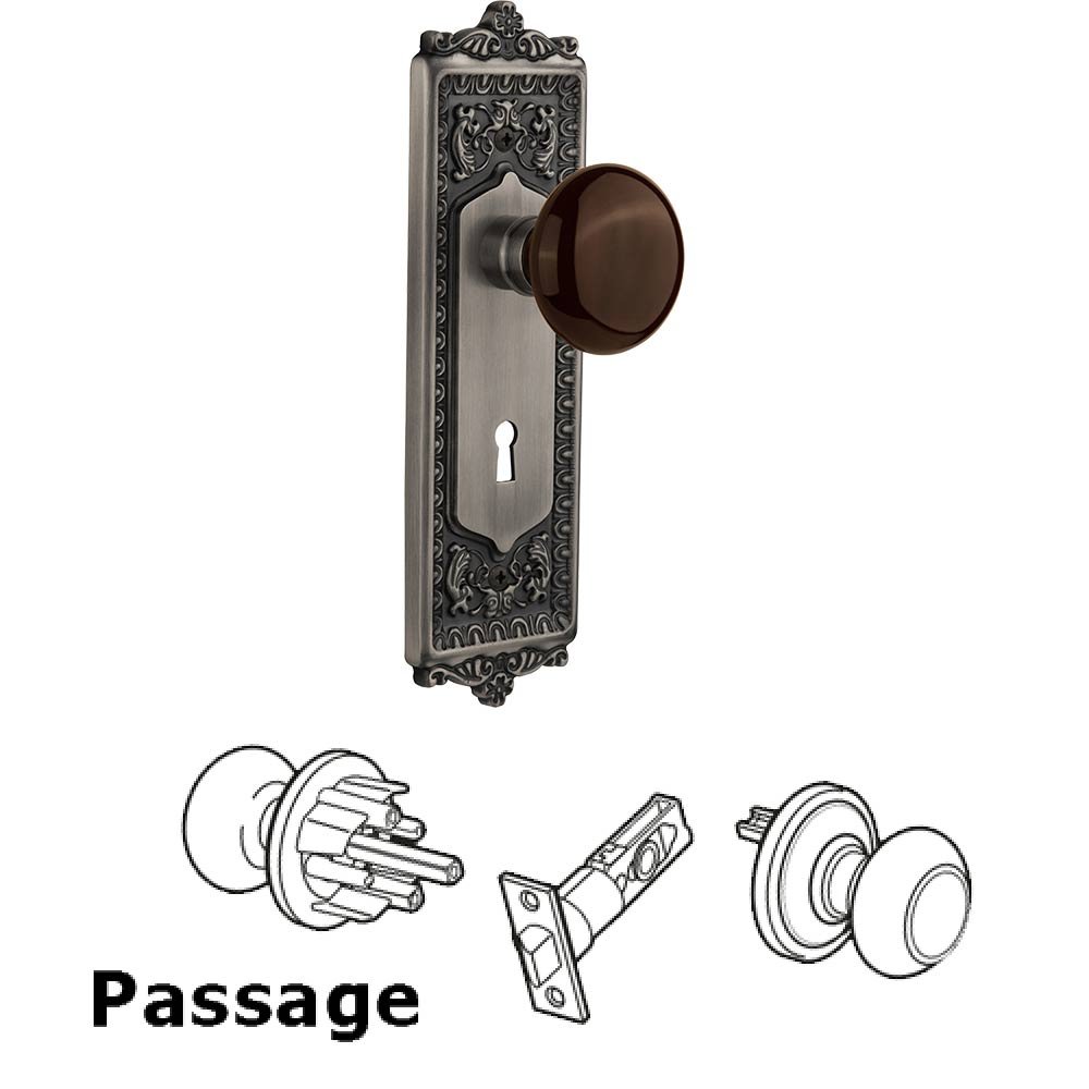 Nostalgic Warehouse Passage Egg & Dart Plate with Keyhole and Brown Porcelain Door Knob in Antique Pewter