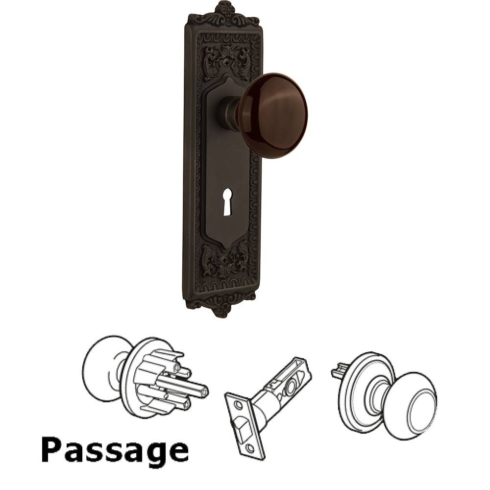 Nostalgic Warehouse Passage Egg & Dart Plate with Keyhole and Brown Porcelain Door Knob in Oil-Rubbed Bronze