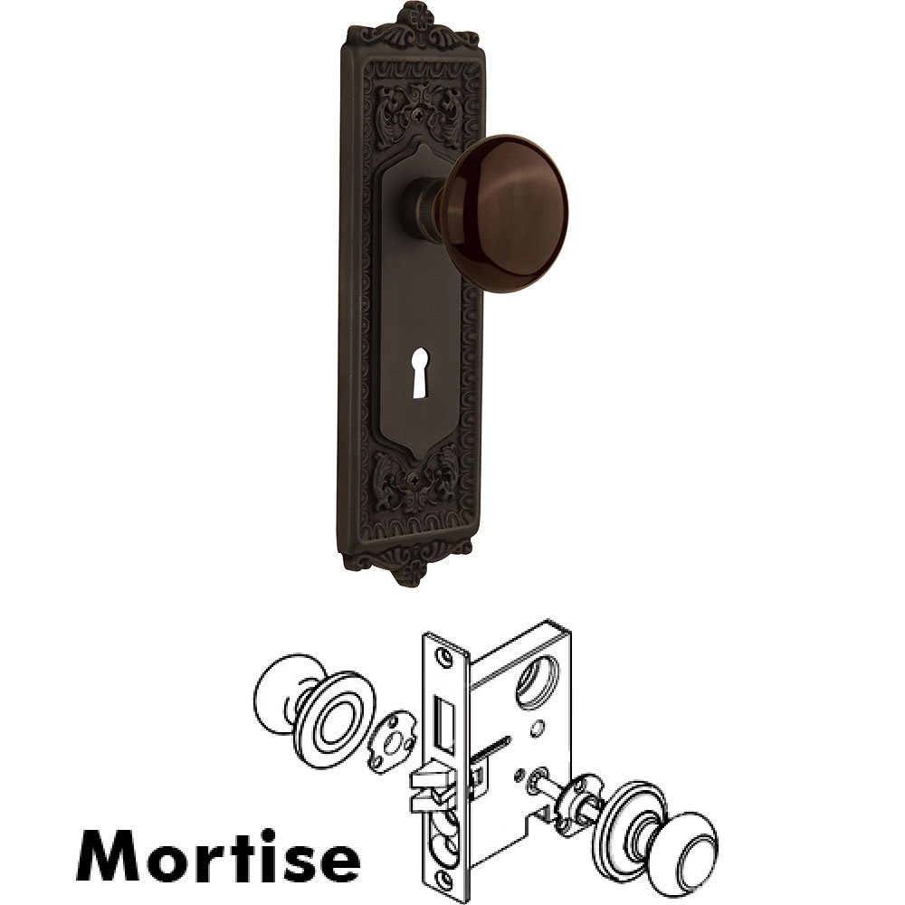 Nostalgic Warehouse Mortise - Egg and Dart Plate with Brown Porcelain Knob with Keyhole in Oil Rubbed Bronze