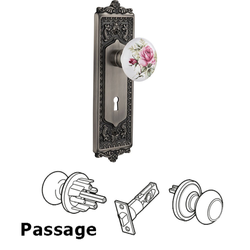 Nostalgic Warehouse Passage Egg & Dart Plate with Keyhole and White Rose Porcelain Door Knob in Antique Pewter
