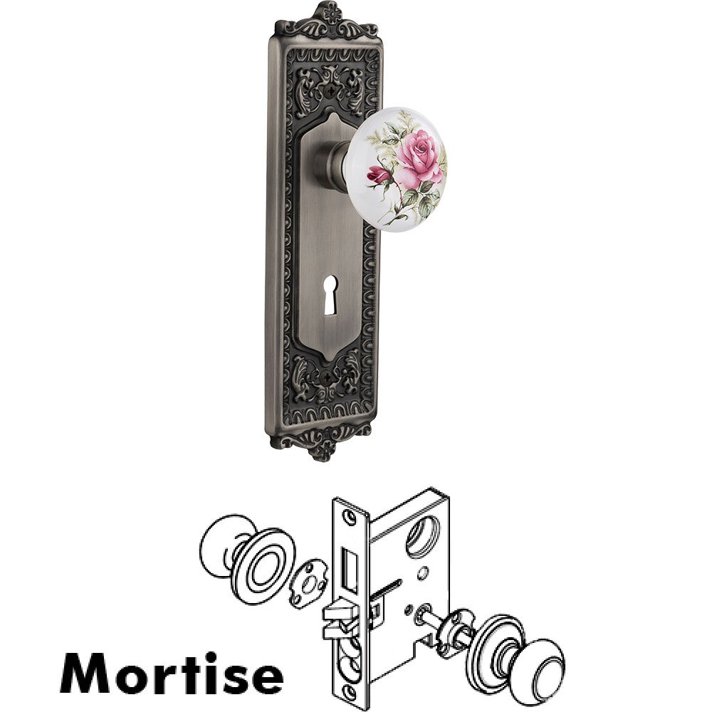 Nostalgic Warehouse Mortise - Egg and Dart Plate with Rose Porcelain Knob with Keyhole in Antique Pewter