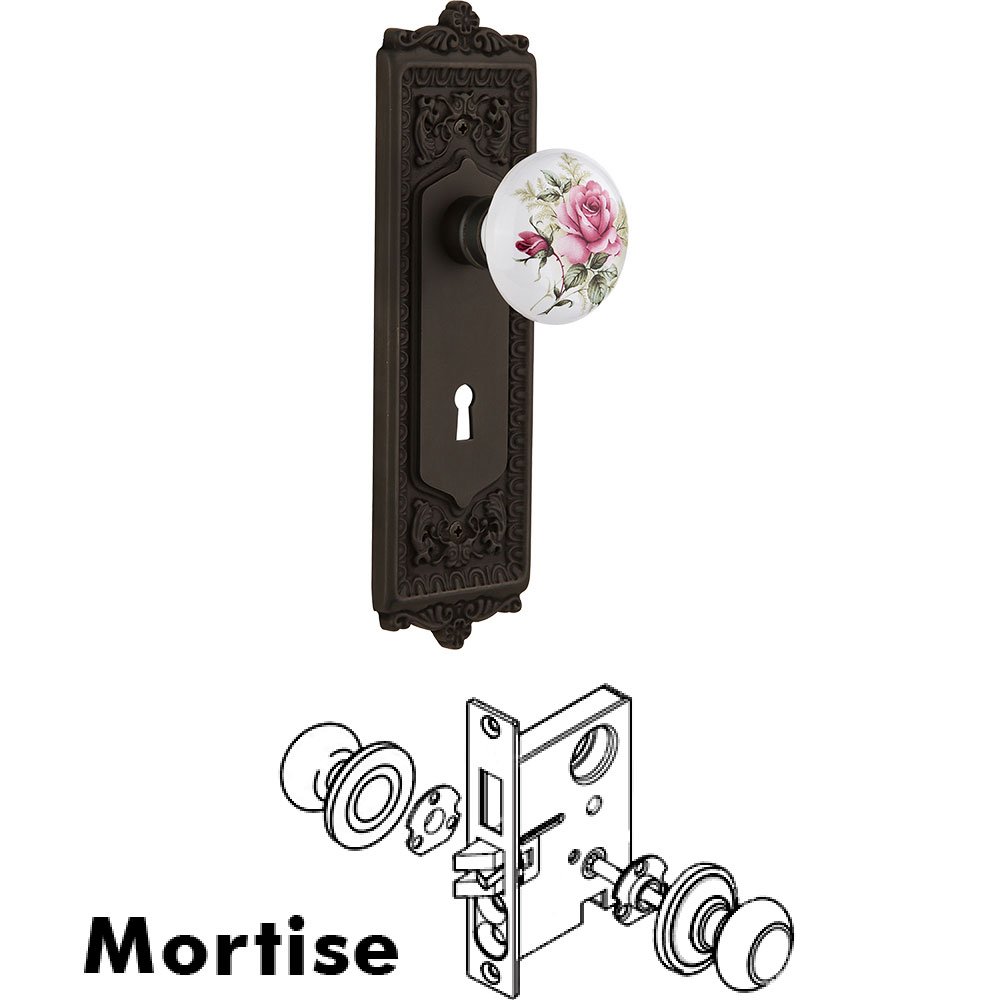 Nostalgic Warehouse Mortise - Egg and Dart Plate with Rose Porcelain Knob with Keyhole in Oil Rubbed Bronze