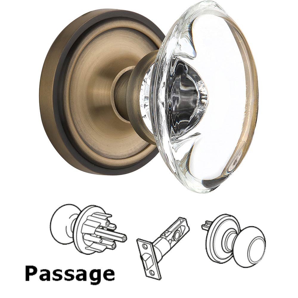 Nostalgic Warehouse Passage Knob - Classic Rose with Oval Clear Crystal Knob in Antique Brass