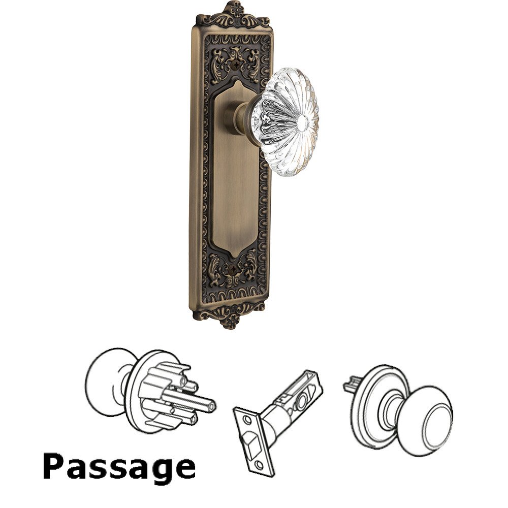 Nostalgic Warehouse Passage Knob - Egg and Dart Plate with Oval Fluted Crystal Knob without Keyhole in Antique Brass