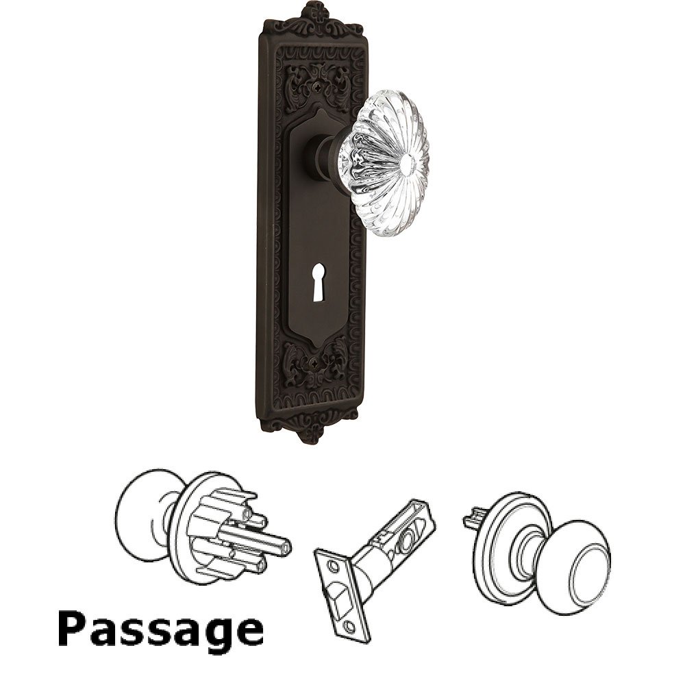 Nostalgic Warehouse Passage Egg & Dart Plate with Keyhole and Oval Fluted Crystal Glass Door Knob in Oil-Rubbed Bronze