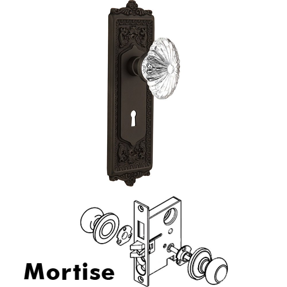 Nostalgic Warehouse Mortise - Egg and Dart Plate with Oval Fluted Crystal Knob with Keyhole in Oil Rubbed Bronze