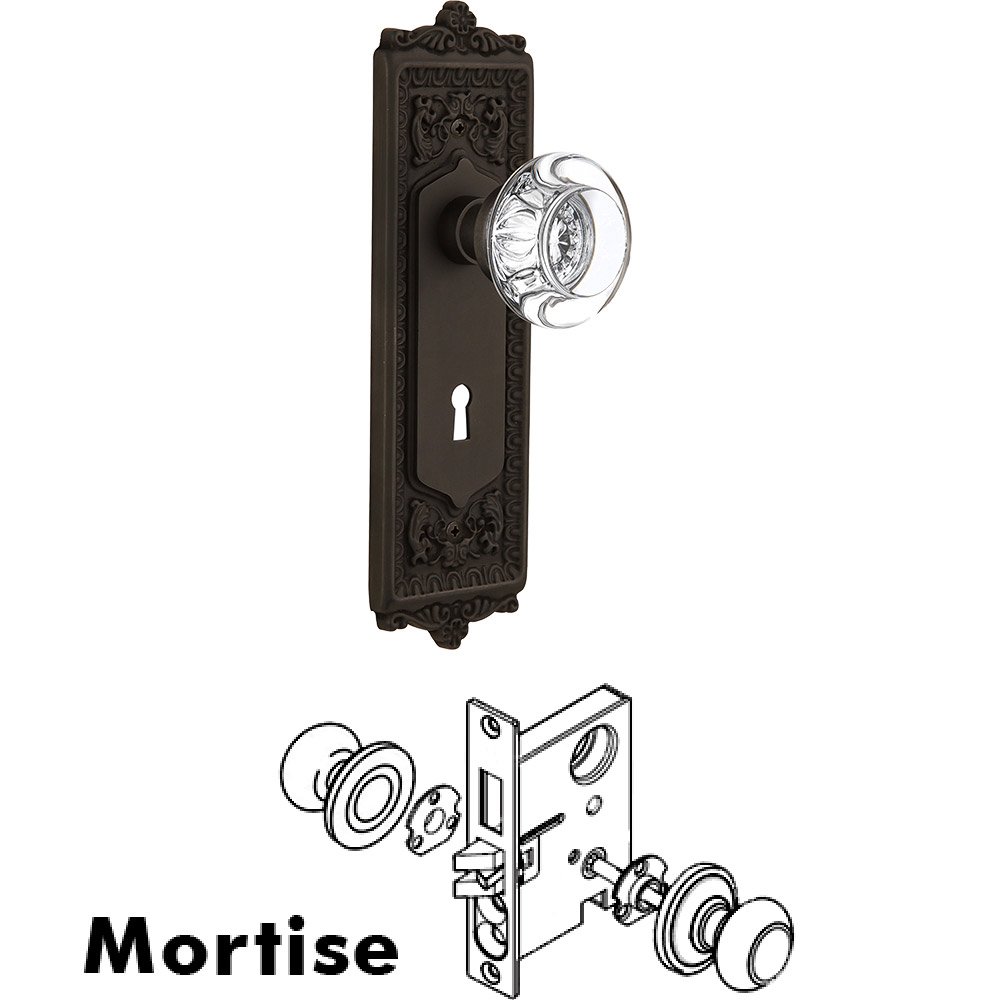 Nostalgic Warehouse Mortise - Egg and Dart Plate with Round Clear Crystal Knob with Keyhole in Oil Rubbed Bronze