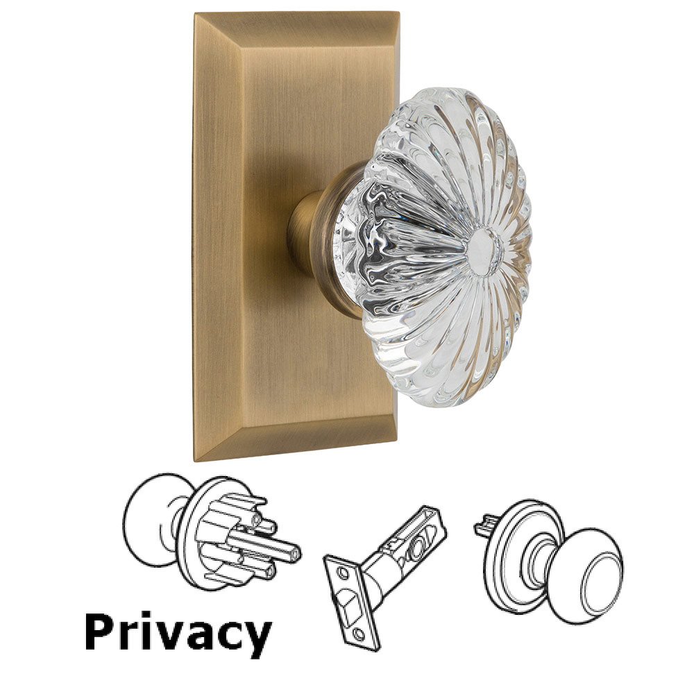 Nostalgic Warehouse Privacy Studio Plate with Oval Fluted Crystal Knob in Antique Brass