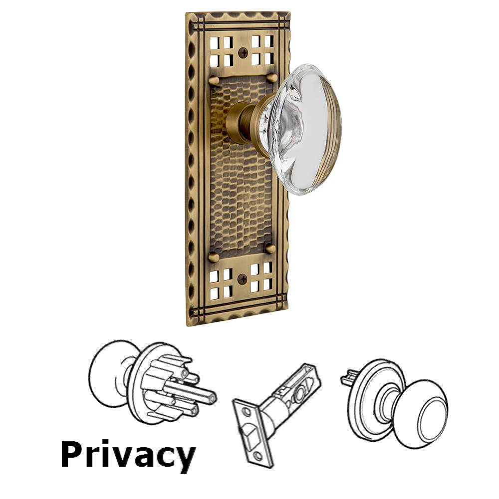 Nostalgic Warehouse Privacy Craftsman Plate with Oval Clear Crystal Glass Door Knob in Antique Brass