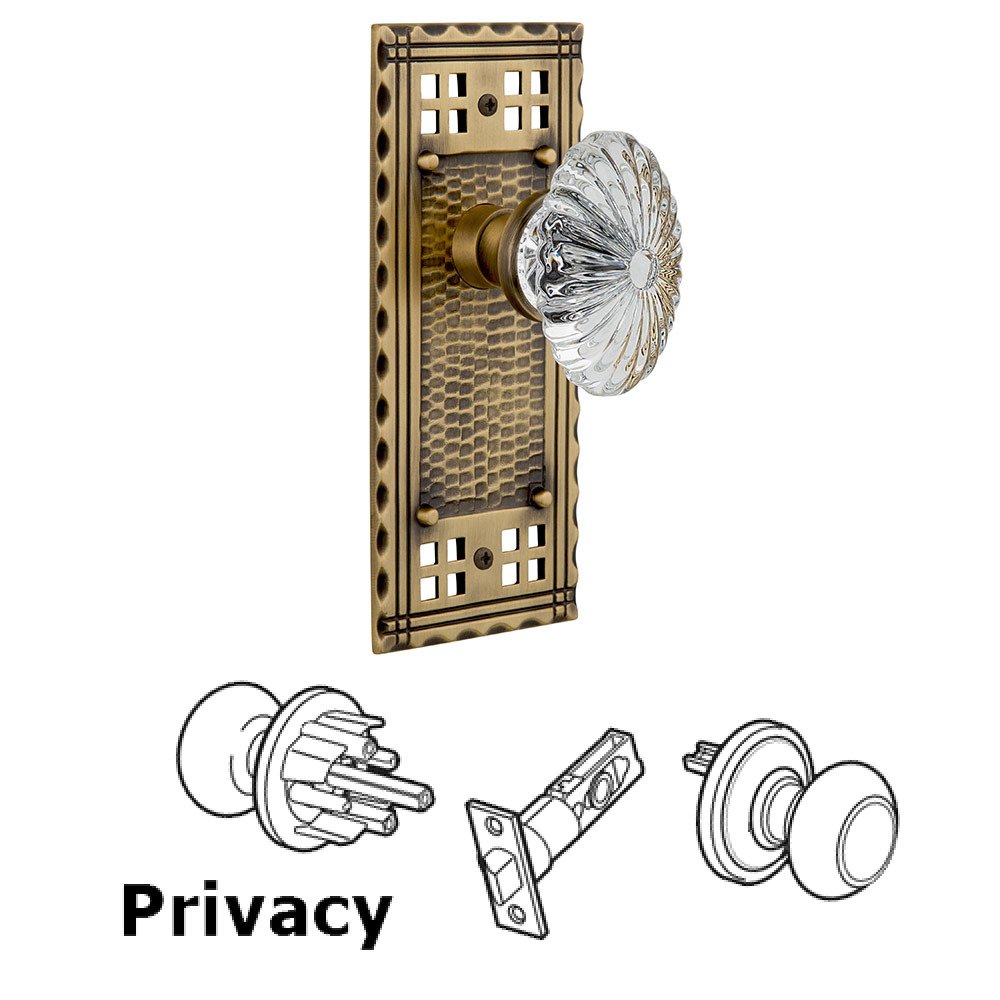 Nostalgic Warehouse Privacy Craftsman Plate with Oval Fluted Crystal Glass Door Knob in Antique Brass