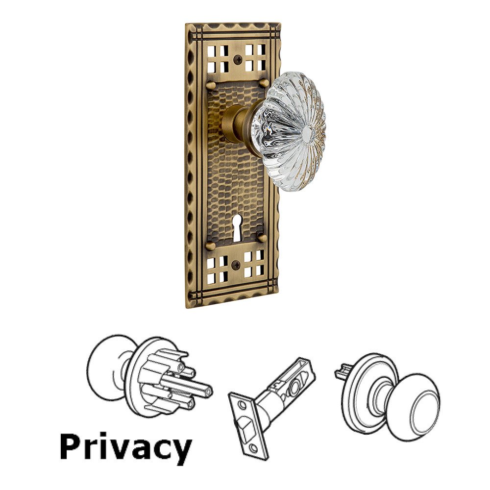 Nostalgic Warehouse Privacy Craftsman Plate with Keyhole and Oval Fluted Crystal Glass Door Knob in Antique Brass