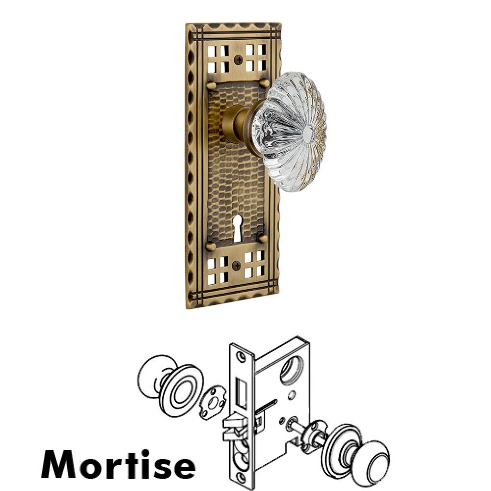 Nostalgic Warehouse Mortise Craftsman Plate with Oval Fluted Crystal Knob and Keyhole in Antique Brass