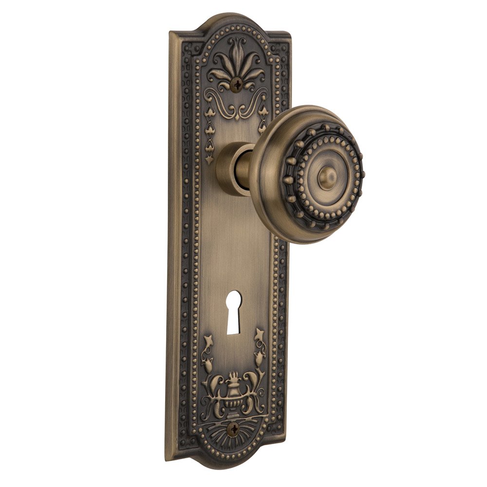 Nostalgic Warehouse Passage Meadows Plate with Keyhole and Meadows Door Knob in Antique Brass