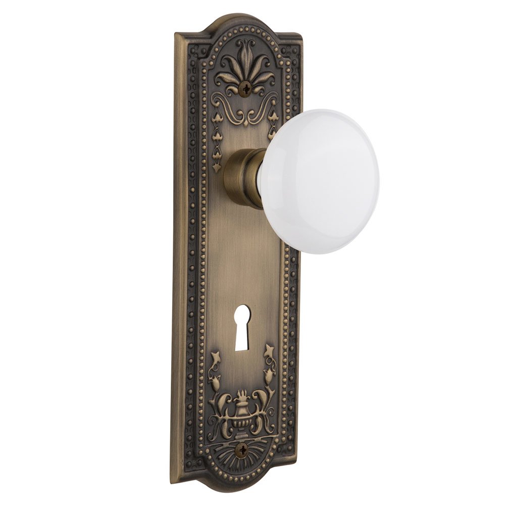 Nostalgic Warehouse Double Dummy Meadows Plate with Keyhole and White Porcelain Door Knob in Antique Brass