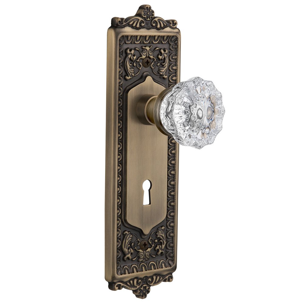 Nostalgic Warehouse Privacy Egg & Dart Plate with Keyhole and Crystal Glass Door Knob in Antique Brass