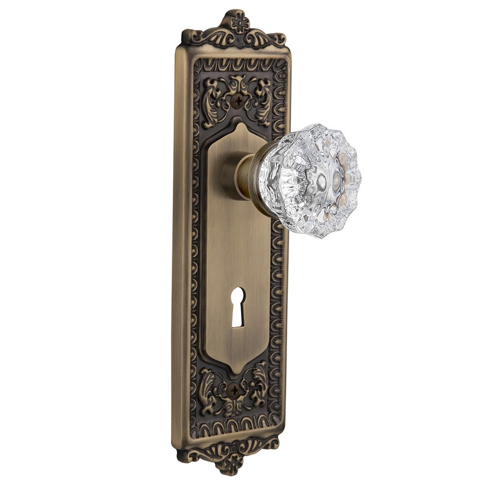 Nostalgic Warehouse Passage Egg & Dart Plate with Keyhole and Crystal Glass Door Knob in Antique Brass