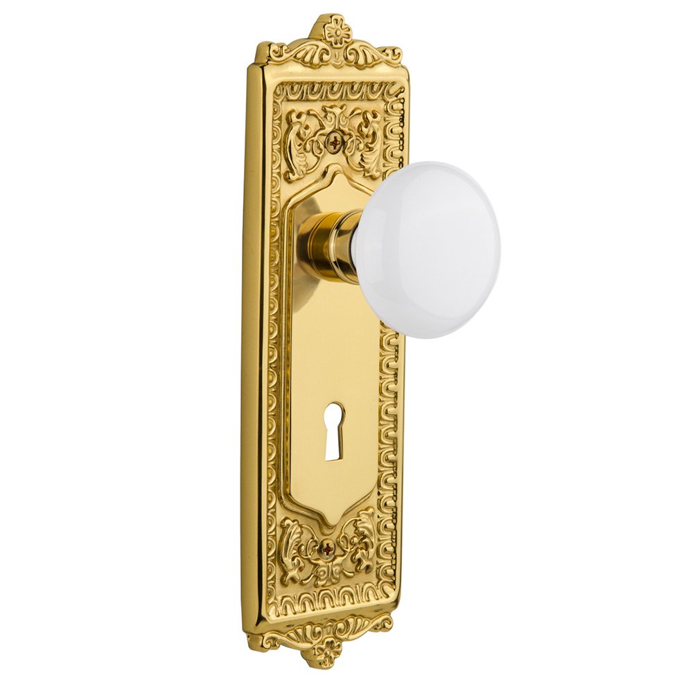 Nostalgic Warehouse Passage Egg & Dart Plate with Keyhole and White Porcelain Door Knob in Polished Brass